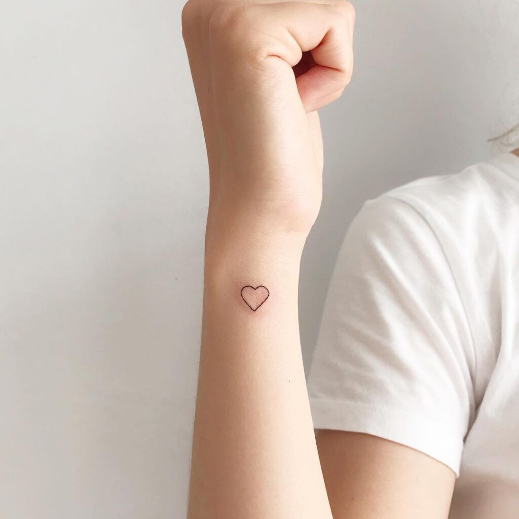cutest heart tattoo on the wrist