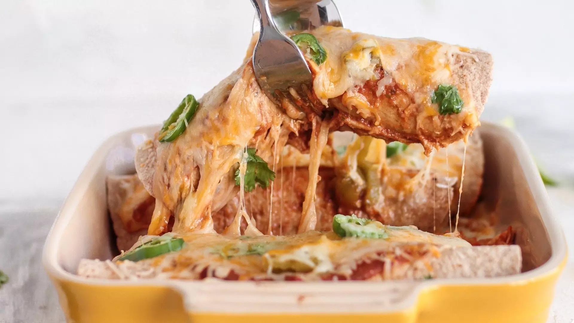 Mexican Baked Pancakes With Lots of Cheese and Sauce