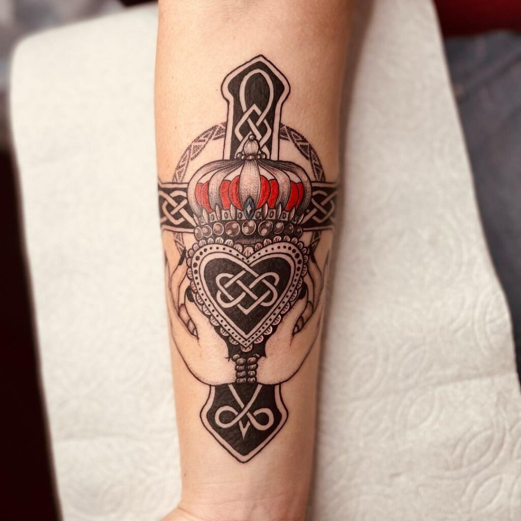 gorgeous celtic cross tattoo on the arm