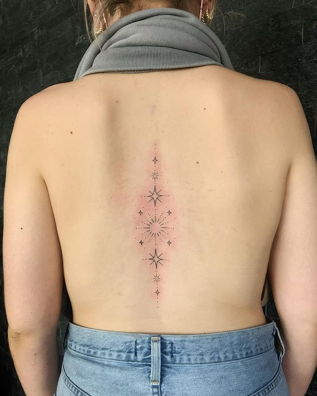 star patchwork tattoo on the back